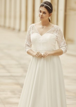 Obrázek ženy se svatebními šaty Fuli od značky Enzoani